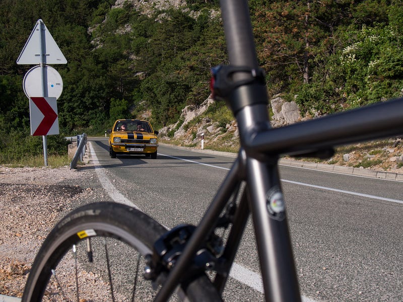 Here is my Canyon photobombed by an old Opel on the climb from Baška, our family’s temporary residence.